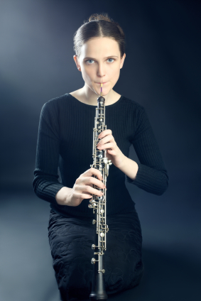 https://www.istockphoto.com/stock-photo-18261210-young-musician-woman-playing-oboe-musical-instrument.php?st=c3bcc3c